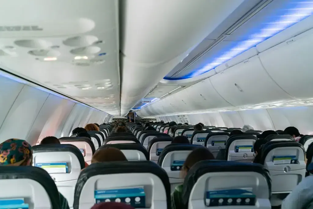 Inside a plane with all passengers seated